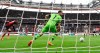 Eintracht Frankfurt's Hugo Ekitik', left, scores the goal to make it 1-1 against Leverkusen goalkeeper Lukas Hradecky during a Bundesliga soccer match at Deutsche Bank Park in Frankfurt, Germany, Sunday, May 5, 2024. Bayer Leverkusen’s Hrádecký set a record for a foreign-born goalkeeper in the Bundesliga Sunday by making his 292nd appearance. (Arne Dedert/dpa via AP)