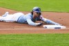 Kansas City Royals' Bobby Witt Jr. slides into third base after a hitting a triple during the first inning of a baseball game against the Texas Rangers, Sunday, May 5, 2024, in Kansas City, Mo. (AP Photo/Nick Tre. Smith)