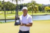 Individual champion captain Brooks Koepka, of Smash GC, poses with the trophy after the final round of LIV Golf Singapore at Sentosa Golf Club, Sunday, May 5, 2024, in Sentosa, Singapore. (Jon Ferrey/LIV Golf via AP)