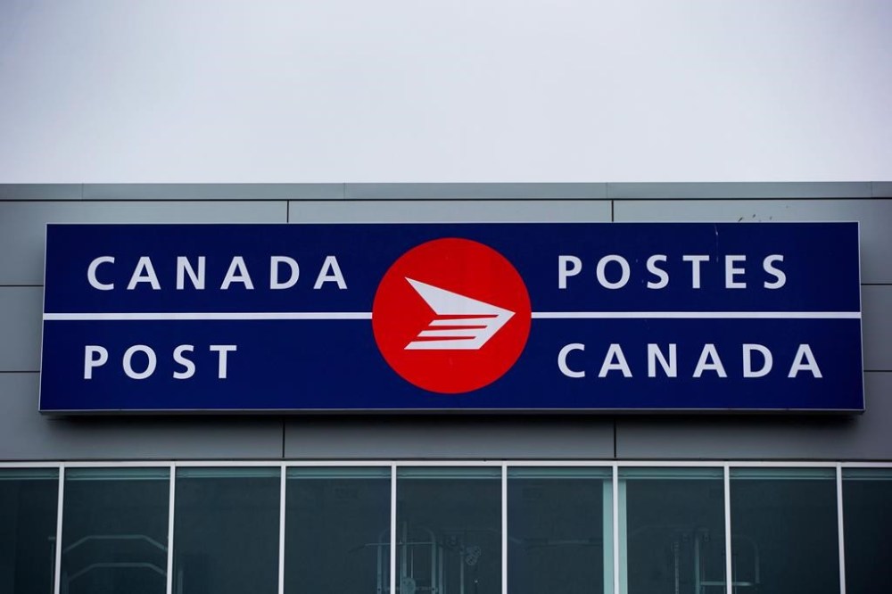 An increase in the cost to send a letter in Canada took effect Monday. The cost of stamps purchased in a booklet, coil or pane is now 99 cents per stamp, an increase of seven cents. The Canada Post logo is seen in Richmond, B.C., on Thursday, June 1, 2017. THE CANADIAN PRESS/Darryl Dyck