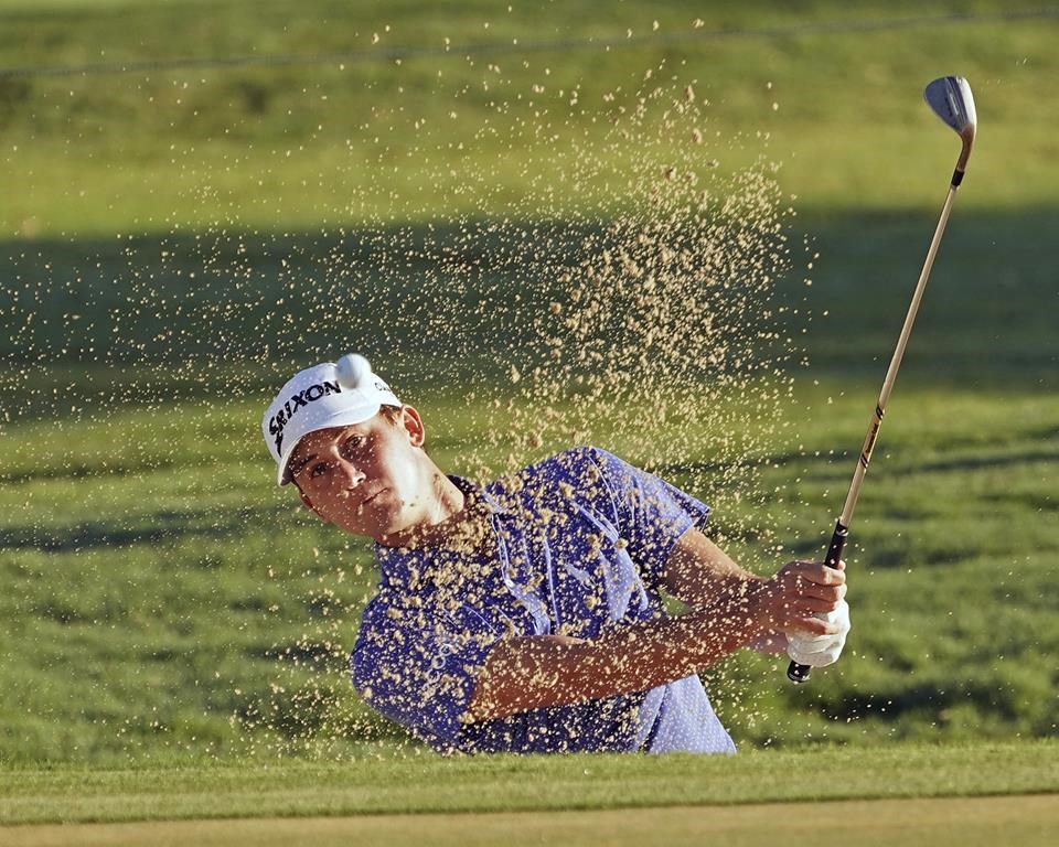FILE - Smylie Kaufman hits out of a green side bunker on the 13th hole during the second round of the Sony Open golf tournament, Friday, Jan. 12, 2018, in Honolulu. NBC says Kaufman's