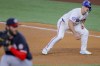 Texas Rangers' Wyatt Langford, right, takes a lead off of first base as Washington Nationals starting pitcher Trevor Williams, left, delivers during the fourth inning of a baseball game in Arlington, Texas, Wednesday, May 1, 2024. (AP Photo/Gareth Patterson)