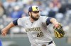 Milwaukee Brewers pitcher Bryse Wilson delivers to a Kansas City Royals batter during the first inning of a baseball game in Kansas City, Mo., Monday, May 6, 2024. (AP Photo/Colin E. Braley)