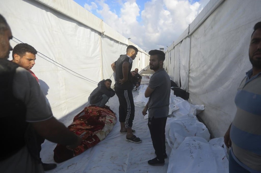 Palestinians mourn their relatives killed in the Israeli bombardment in Rafah, Gaza Strip, Tuesday, May 7, 2024. (AP Photo/Ismael Abu Dayyah)