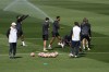 Real Madrid's head coach Carlo Ancelotti, left, watches Real Madrid's Jude Bellingham, centre, and others train in Madrid, Spain, Tuesday, May 7, 2024. The semifinal second leg Champions League soccer match between Real Madrid Bayern Munich will be played on Wednesday in Madrid. (AP Photo/Paul White)
