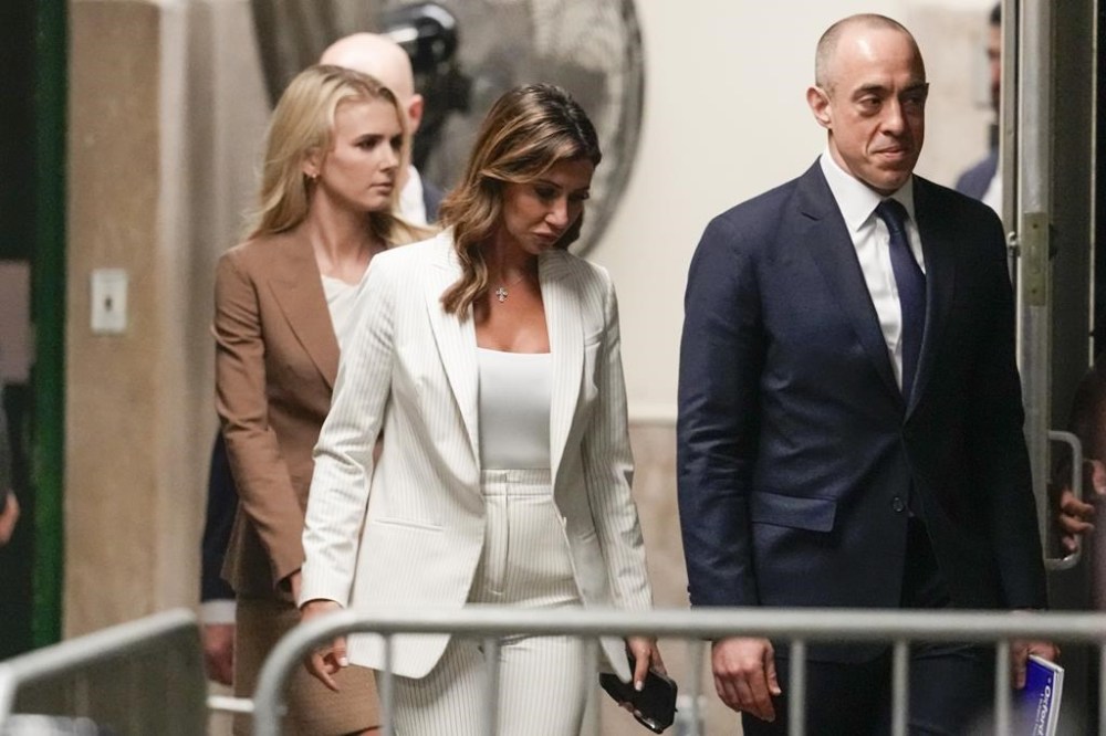 Former President Donald Trump's attorneys Alina Habba, center, and Emil Bove return to the courtroom following a break in his trial, Tuesday, May 7, 2024 in New York. (AP Photo/Mary Altaffer, Pool)