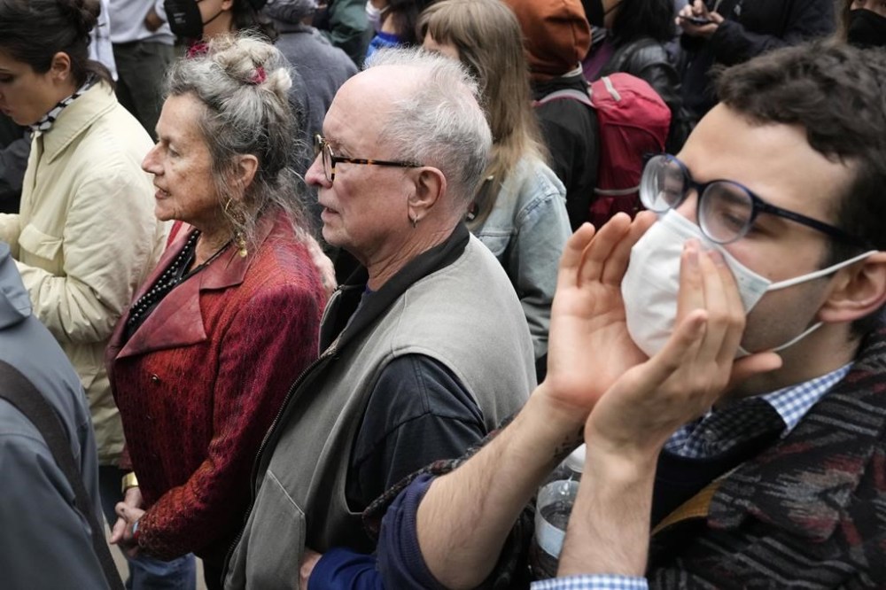Bernardine Dohrn, left, and Bill Ayers, center, founders of the Weather Underground, participate in a pro-Palestinian protest at the University of Chicago Tuesday, May 7, 2024, in Chicago. (AP Photo/Charles Rex Arbogast)