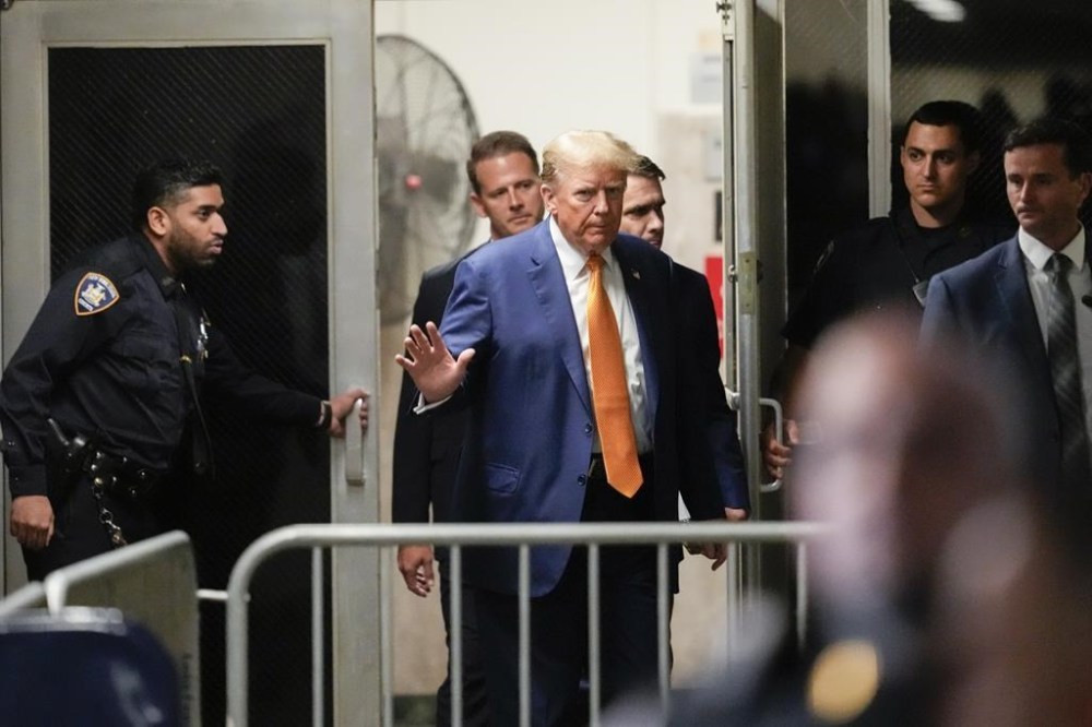 Former President Donald Trump gestures to reporters as he returns to the courtroom after a break in his trial, Tuesday, May 7, 2024, in New York. (AP Photo/Mary Altaffer, Pool)