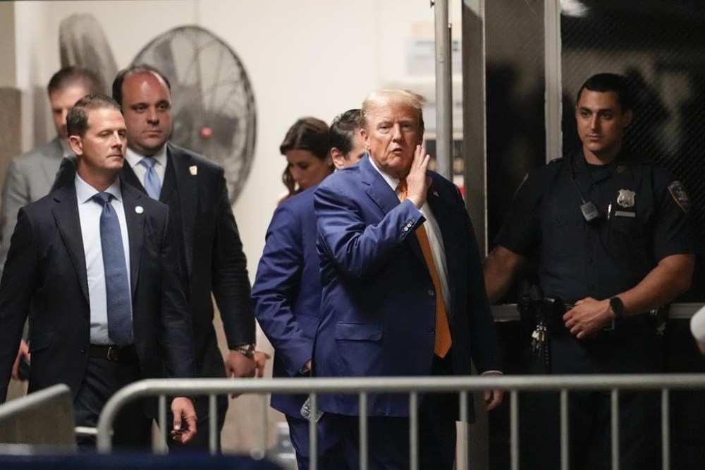 Former President Donald Trump speaks to reporters as he returns to the courtroom following an afternoon break in his trial, Tuesday, May 7, 2024, in New York. (AP Photo/Mary Altaffer, Pool)