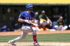 Texas Rangers' Josh Smith watches his RBI single against the Oakland Athletics during the second inning of a baseball game Tuesday, May 7, 2024, in Oakland, Calif. (AP Photo/Godofredo A. Vásquez)