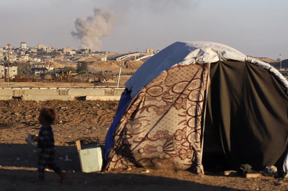 Smoke rises following an Israeli airstrike on buildings near the separating wall between Egypt and Rafah, southern Gaza Strip, Tuesday, May 7, 2024. (AP Photo/Ramez Habboub)