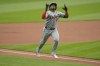 Detroit Tigers' Andy Ibáñez gestures as he nears home plate with a home run against the Cleveland Guardians during the first inning of a baseball game Tuesday, May 7, 2024, in Cleveland. (AP Photo/Sue Ogrocki)
