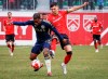 Vancouver Whitecaps FC defender Javain Brown (left) controls the ball as Cavalry FC attacker Lleyton Brooks checks during first half soccer action in the Canadian Championship quarterfinal, leg 1, in Calgary, Tuesday, May 7, 2024. THE CANADIAN PRESS/Jeff McIntosh