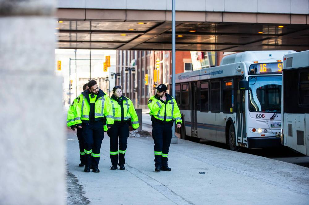 MIKAELA MACKENZIE / FREE PRESS Files
Transit safety officers walk down Graham Avenue.