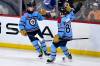 Fred Greenslade / THE CANADIAN PRESS
                                Cole Perfetti (left) celebrates with Nate Schmidt Tuesday after scoring the go-ahead goal against the L.A. Kings.