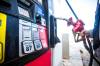 MIKAELA MACKENZIE / WINNIPEG FREE PRESS Kathleen Chan gasses up at higher prices in Winnipeg on Thursday, March 3, 2022. For —- story. Winnipeg Free Press 2022.