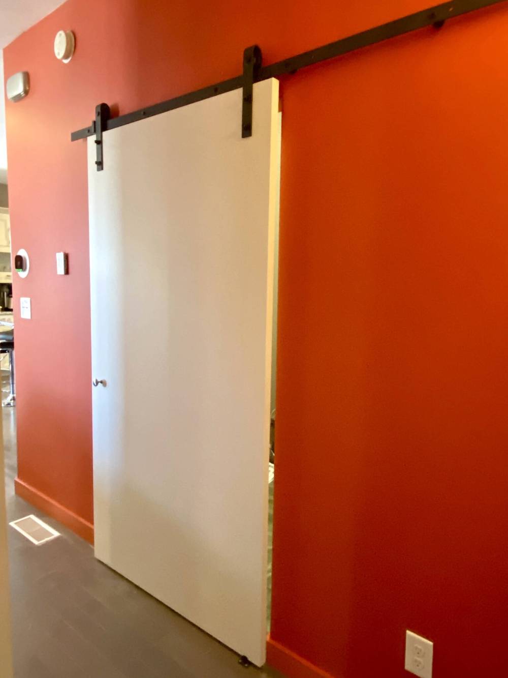 Photos by Marc LaBossiere / Free Press
The barn door painted off-white was mounted to hide the laundry room along the feature wall of the hallway.