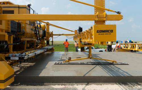 SARAH TAYLOR / FREE PRESS FILES
                                tion teams use a concrete paver to form the concrete once it&rsquo;s laid as they work on Highway 75 south of St. Norbert. - Dan Letts story