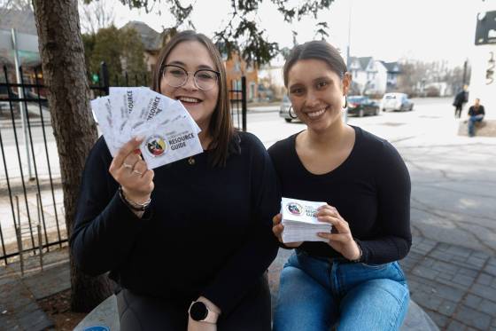Tammie Kolbuck (left) and Brittney Nygaard, co-chairs of the Winnipeg Outreach Network, show off the updated street guide. *Mike Deal / Free Press)