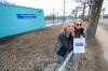 Ruth Bonneville / Free Press
                                Christine Trickey (left) and Michelle Berger hold a flyer they are distributing to St. Boniface residents in hopes of saving Happyland pool.