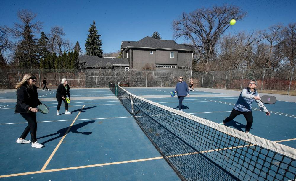 From left, Sandy Rosenberg, Sharon Berkowitz, Libby Broder and Judy Doctoroff take advantage of the spring weather by playing some pickle ball at the public courts on Wellington Crescent. (John Woods / Free Press)