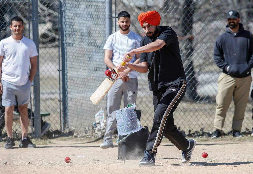 Prabhveer Singh plays some cricket with his friends at Tyndall Park Community Centre. (John Woods / Free Press)