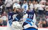 DAVID ZALUBOWSKI / THE ASSOCIATED PRESS
                                Winnipeg left-winger Alex Iafallo, left, congratulates goaltender Connor Hellebuyck Saturday’s win over the Colorado Avalanche, Saturday.