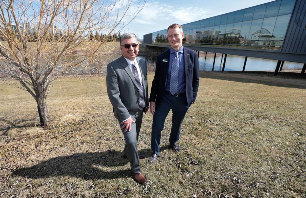 Ruth Bonneville / Free Press
RTDS Technologies CEO Kelly McNeill (right) and former internship student turned R&D supervisor Ali Dehkordi outside the company’s head office Monday in Winnipeg. RTDS was one of the first Manitoba companies to participate in Mitacs internship programs and Dehkordi was one of its first PhD student interns in 2003.