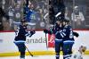 THE CANADIAN PRESS/Fred Greenslade
                                Winnipeg Jets’ Kyle Connor celebrates his goal against the Seattle Kraken with Mark Scheifele and Gabriel Vilardi during the first period in Winnipeg on Tuesday.