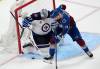 DAVID ZALUBOWSKI / THE ASSOCIATED PRESS
                                Winnipeg Jets goaltender Connor Hellebuyck stops a shot by Colorado right-winger Valeri Nichushkin during the third period of Game 3 Friday.