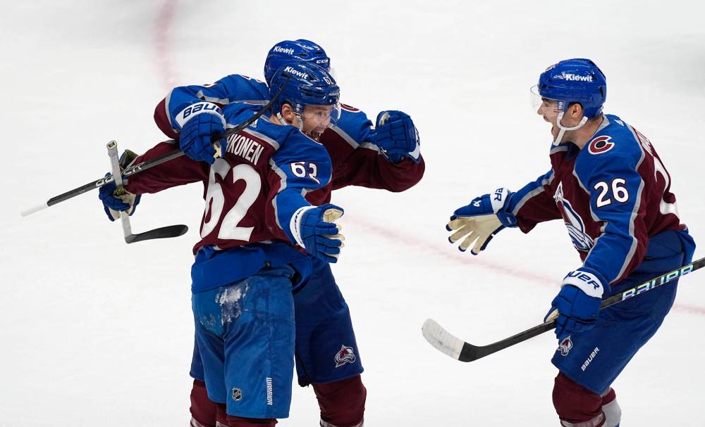 Colorado Avalanche left wing Artturi Lehkonen, front left, celebrates after scoring a goal with left wing Zach Parise, back left, and defenseman Sean Walker, right, in the first period of Game 4 of an NHL Stanley Cup first-round playoff series against the Winnipeg Jets, Sunday, April 28, 2024, in Denver. (David Zalubowski / The Associated Press)