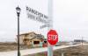 MIKE DEAL / FREE PRESS
                                Street signs in a new development in Waverley West that have two names on them. The developer of the neighbourhood is asking the city to consider changing the name from Sheryl McCorrister Way to Rangeview Way.