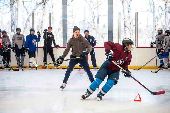 Winnipeg Jets player Mark Scheifele does hockey drills with Justin McGlinchey of the U15 Boys team at the Winnipeg Jets Hockey Academy at Camp Manitou on Wednesday. (Mikaela MacKenzie / Free Press)