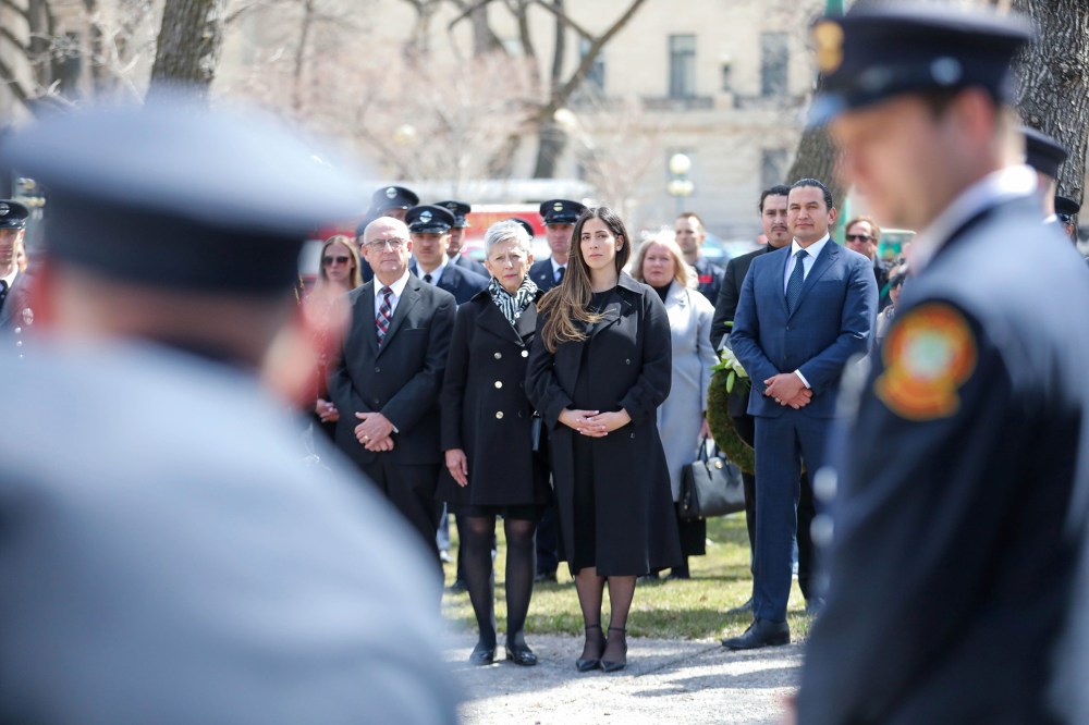 Shayda Tashakor takes in the memorial service for her late husband Preston Heinbigner at Manitoba Workers Memorial in Memorial Park for a ceremony. (Ruth Bonneville / Free Press)