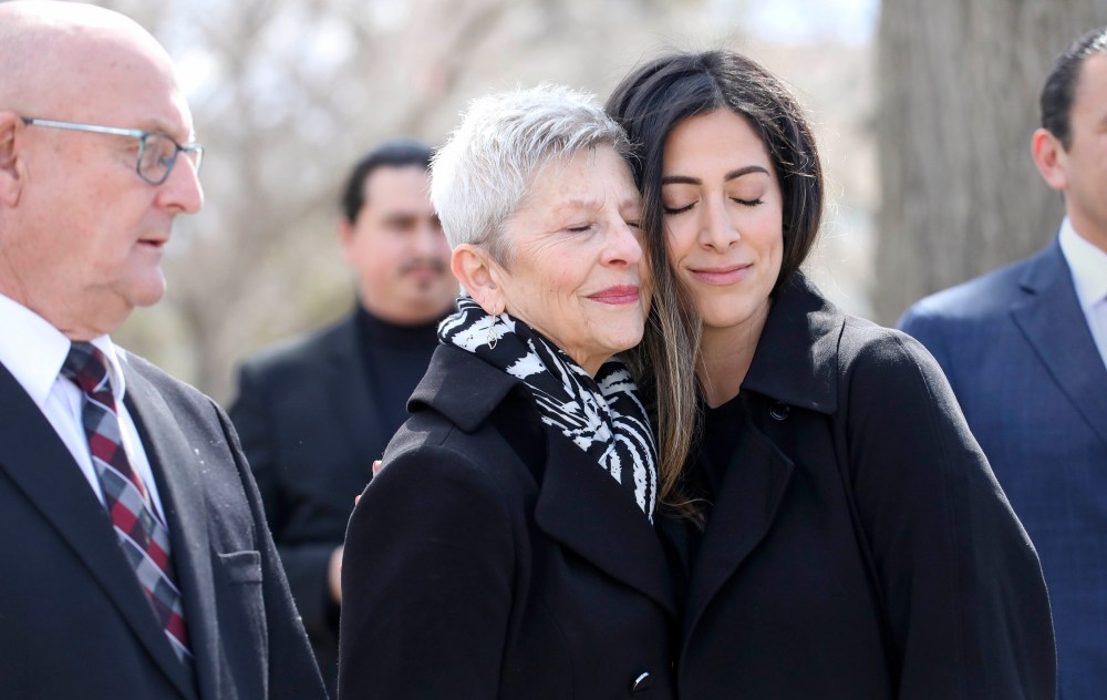 Preston Heinbigner’s mother Elaine Heinbigner and Tashakor, sharing a touching moment together at the Manitoba Workers Memorial. (Ruth Bonneville / Free Press)