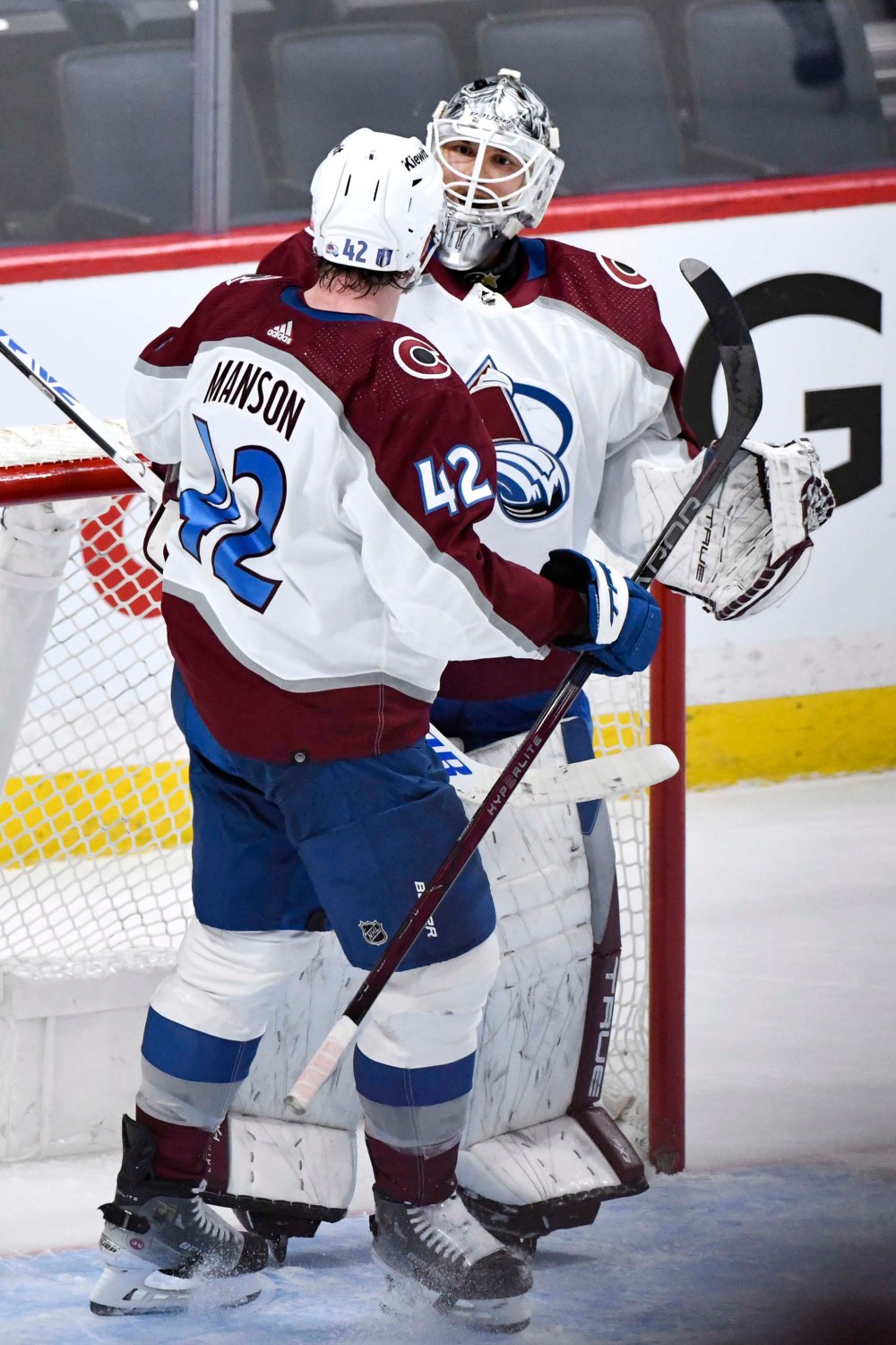Colorado Avalanche Josh Manson celebrates with goaltender Alexandar Georgiev after defeating the Winnipeg Jets Tuesday night at Canada Life Centre in Winnipeg. (Fred Greenslade / The Canadian Press)