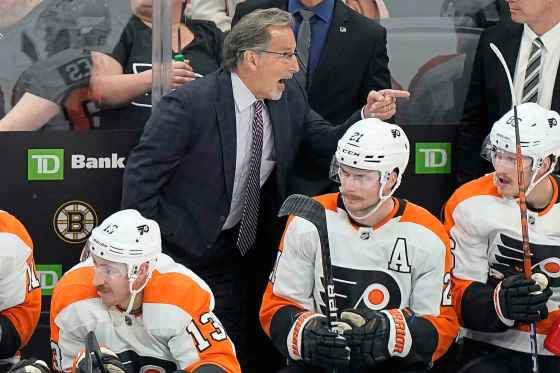 Philadelphia Flyers head coach John Tortorella, centre top, speaks to players from the bench in 2022. (Steven Senne / The Associated Press files)