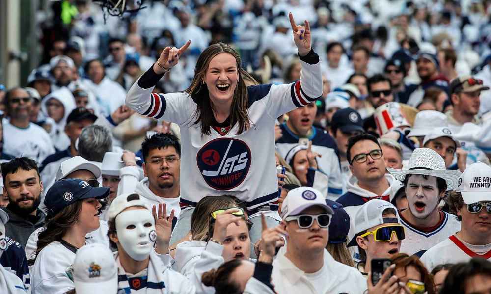 JOHN WOODS / FREE PRESS
Fans react to action on the ice at the Whiteout party on Sunday.