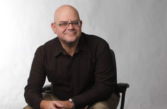 Al Small posing for a staff photo as the Arts and Life Editor in 2013. (Ruth Bonneville / Free Press files)