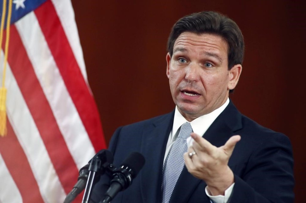 FILE - Florida Gov. Ron DeSantis answers questions from the media, March 7, 2023, at the state Capitol in Tallahassee, Fla. DeSantis admits the book challenge law he enacted two years ago is causing problems for school districts. He signed a bill Tuesday, April 16, 2024, that adjusts the law that made it easy for anyone to have any book removed from school libraries and classrooms, either temporarily or permanently. (AP Photo/Phil Sears, File)