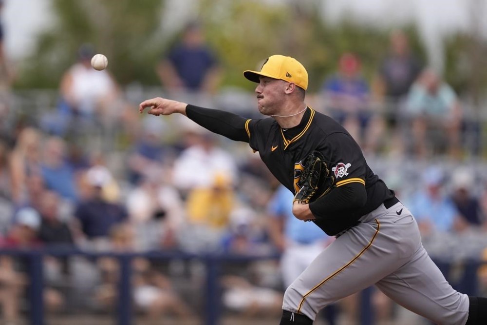FILE - Pittsburgh Pirates pitcher Paul Skenes throws in the fourth inning of a spring training baseball game against the Tampa Bay Rays in Port Charlotte, Fla., Monday, March 4, 2024. Skenes has a 0.53 ERA through five starts at Triple-A this season, but Pirates general manager Ben Cherington said Wednesday the club is in no rush to call up the top overall pick in the 2023 draft. (AP Photo/Gerald Herbert, File)