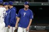 Texas Rangers pitcher Max Scherzer stands outside the dugout after the team's 7-1 win in a baseball game against the Washington Nationals in Arlington, Texas, Tuesday, April 30, 2024. (AP Photo/Tony Gutierrez)