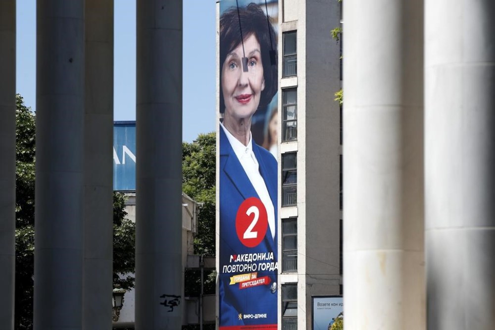 A giant poster of Gordana Siljanovska Davkova, the presidential candidate supported by the center-right main opposition VMRO-DPMNE coalition, hanging on a building in Skopje, North Macedonia, on Monday, May 6, 2024. Voters go to the polls on Wednesday in North Macedonia to cast ballots for parliamentary election and presidential runoff, for the second time in two weeks. (AP Photo/Boris Grdanoski)