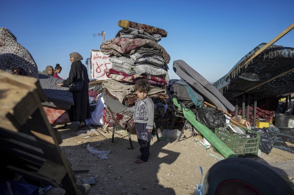 Displaced Palestinians arrive in central Gaza after fleeing from the southern Gaza city of Rafah in Deir al Balah, Gaza Strip, on Wednesday, May 7, 2024. The Israeli army has ordered tens of thousands of people to evacuate Rafah as it conducts a ground operation there. (AP Photo/Abdel Kareem Hana)