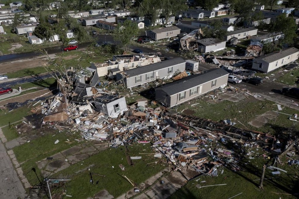 Storm damaged mobile homes are surrounded by debris at Pavilion Estates mobile home park just east of Kalamazoo, Mich. Wednesday, May 8, 2024. A tornado ripped through the area the evening of May 7. (Neil Blake/The Grand Rapids Press via AP)