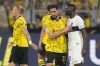 Dortmund's Emre Can touches PSG's Randal Kolo Muani, right, after the Champions League semifinal first leg soccer match between Borussia Dortmund and Paris Saint-Germain at the Signal-Iduna Park stadium in Dortmund, Germany, Wednesday, May 1, 2024. Dortmund won 1-0. (AP Photo/Matthias Schrader)