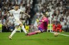 Real Madrid's Joselu scores his side's opening goal during the Champions League semifinal second leg soccer match between Real Madrid and Bayern Munich at the Santiago Bernabeu stadium in Madrid, Spain, Wednesday, May 8, 2024. (AP Photo/Jose Breton)