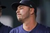 Seattle Mariners relief pitcher Tayler Saucedo reacts in the dugout after being removed in the sixth inning of a baseball game against the Texas Rangers, Wednesday, April 24, 2024, in Arlington, Texas. (AP Photo/Gareth Patterson)
