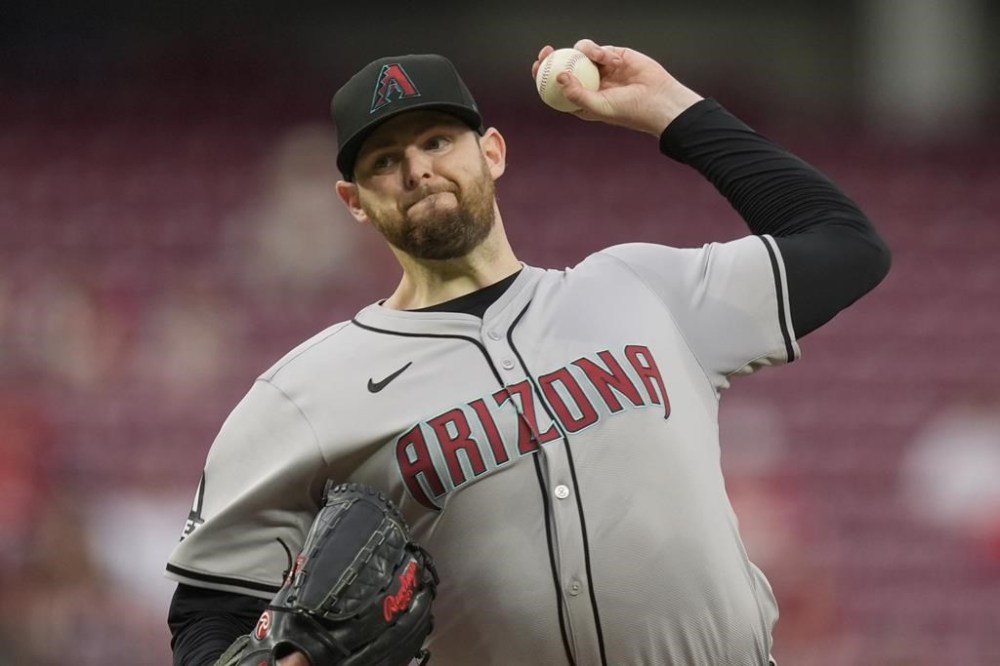 Arizona Diamondbacks starting pitcher Jordan Montgomery throws to a Cincinnati Reds batter during the first inning of a baseball game Wednesday, May 8, 2024, in Cincinnati. (AP Photo/Carolyn Kaster)