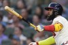 Atlanta Braves designated hitter Marcell Ozuna (20) follows through on a home run in the third inning of a baseball game against the Boston Red Sox Wednesday, May 8, 2024, in Atlanta. (AP Photo/John Bazemore)